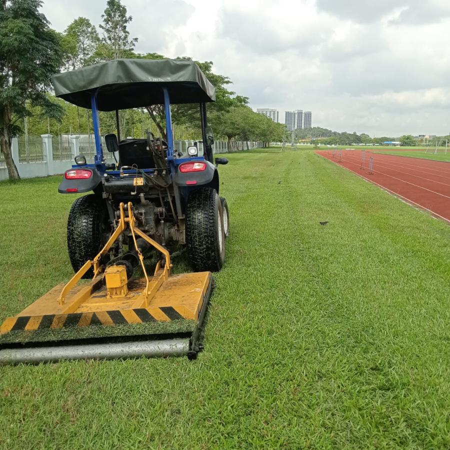 Tractor maintenance sport field