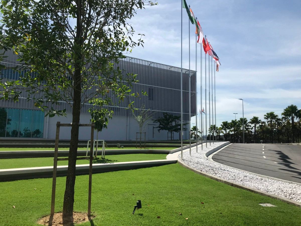 Corporate main entrance with flag court and curved kerb landscaping